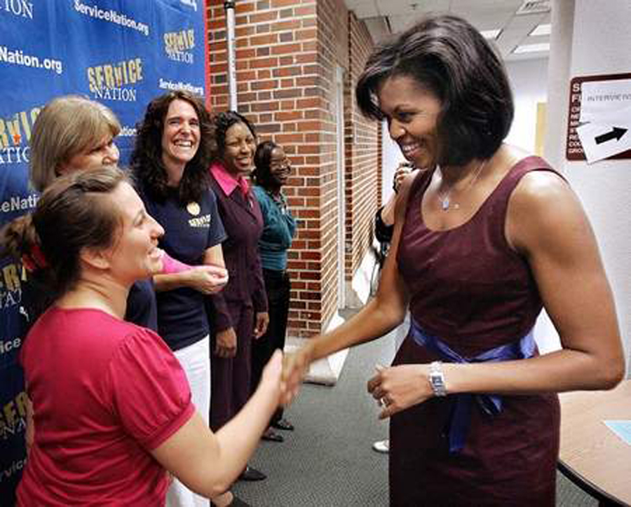 former lineback Michelle greets women