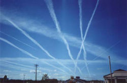Multiple contrails in an area with high airline traffic.