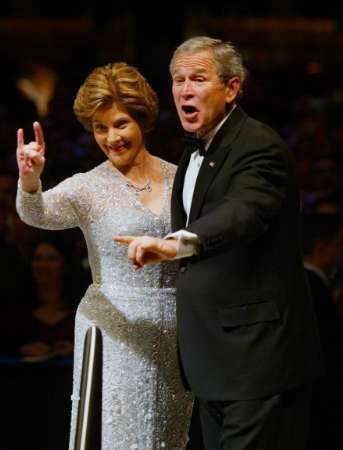 Bush and wife Satanic hand signal (2005 inauguration)